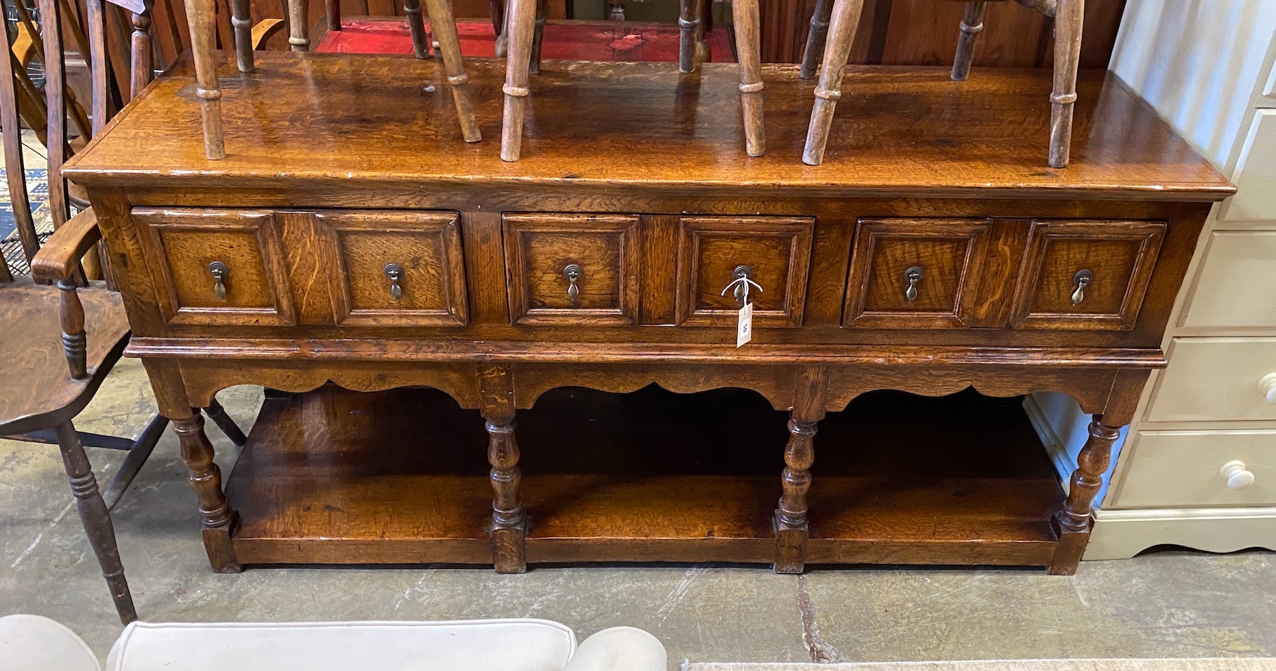 A 20th century Jacobean Revival dresser base with undershelf, width 172cm, depth 51cm, height 86cm